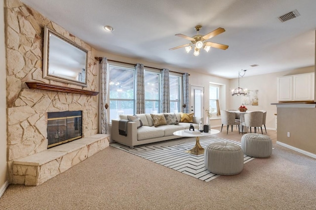 5320 Alta Loma Dr, Fort Worth, TX 76244 - carpeted living area featuring a fireplace, a ceiling fan, and a chandelier