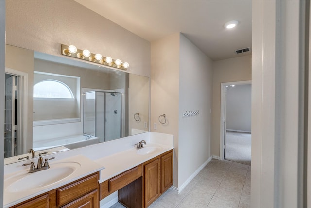 bathroom featuring a garden tub, visible vents, a stall shower, a sink, and tile patterned floors