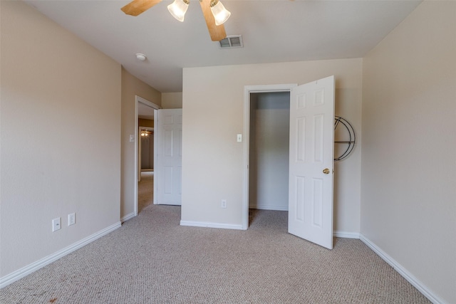 unfurnished bedroom with baseboards, light carpet, and visible vents