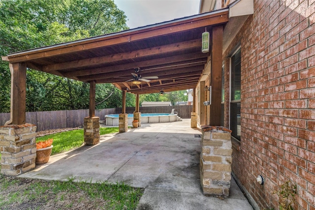 view of patio with a fenced in pool, a ceiling fan, and a fenced backyard