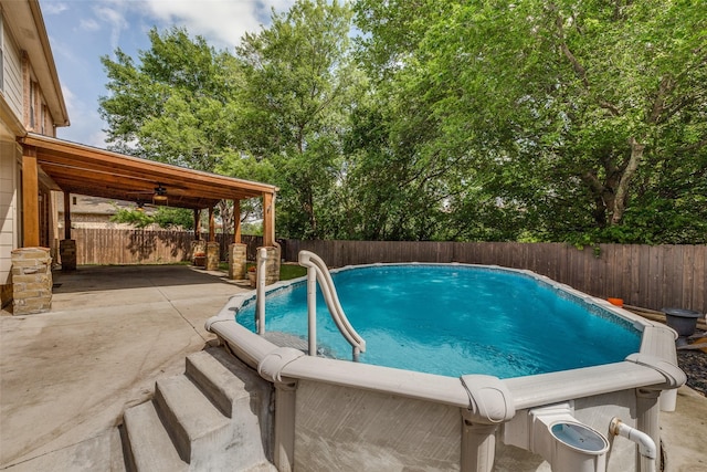 view of swimming pool with a patio, a fenced backyard, and a fenced in pool