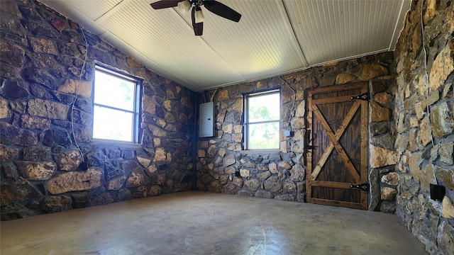 spare room featuring a ceiling fan and electric panel