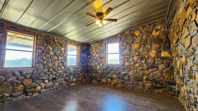 unfurnished room with a ceiling fan, hardwood / wood-style flooring, and lofted ceiling