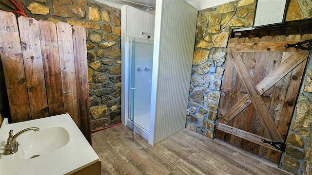 bathroom featuring vanity and wood finished floors
