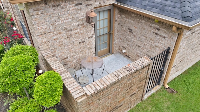 exterior space with brick siding