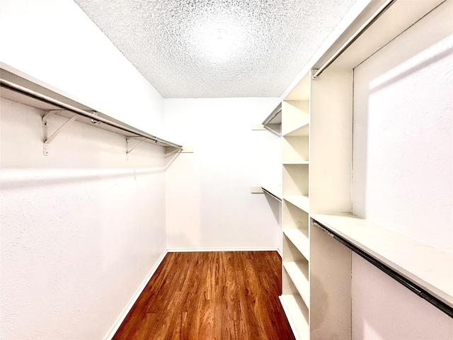 919 S Weatherred Dr Unit 211, Richardson, TX 75080 - spacious closet with dark wood-style flooring