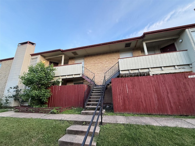 919 S Weatherred Dr Unit 211, Richardson, TX 75080 - back of property featuring brick siding and stairway