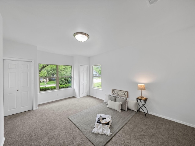 unfurnished room with carpet floors and baseboards