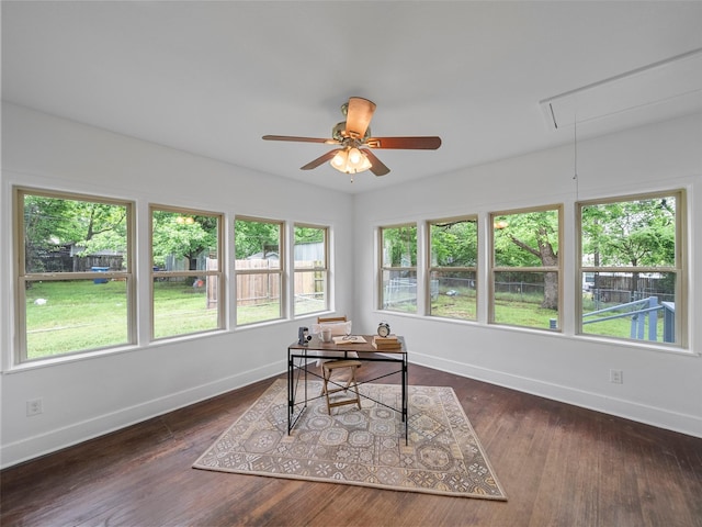 office area featuring baseboards, attic access, dark wood-style flooring, and ceiling fan