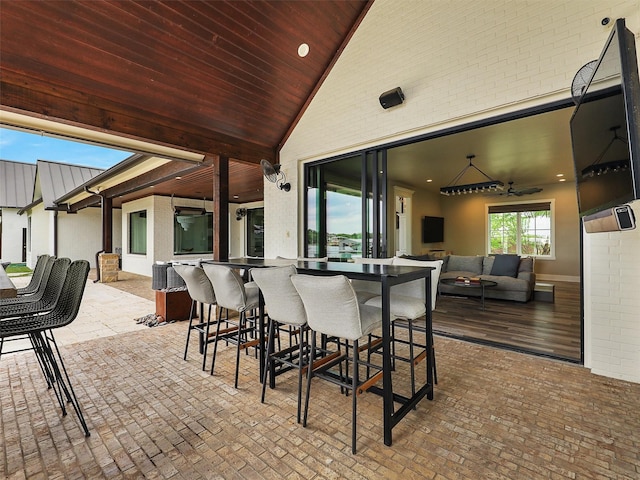 1018 Chaparrel Ln, Graford, TX 76449 - view of patio / terrace featuring outdoor lounge area, an outdoor bar, and a ceiling fan