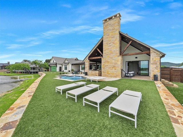 1018 Chaparrel Ln, Graford, TX 76449 - rear view of property featuring stone siding, a chimney, and a patio