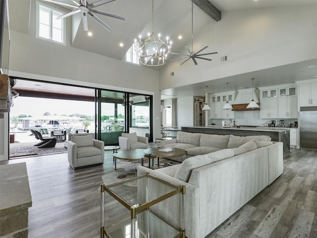1018 Chaparrel Ln, Graford, TX 76449 - living area featuring ceiling fan, high vaulted ceiling, a chandelier, dark wood-style floors, and beam ceiling