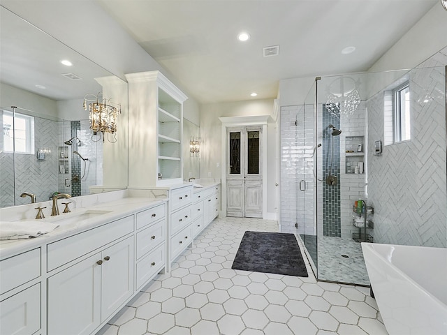 1018 Chaparrel Ln, Graford, TX 76449 - bathroom with a shower stall, vanity, tile patterned floors, recessed lighting, and a freestanding tub