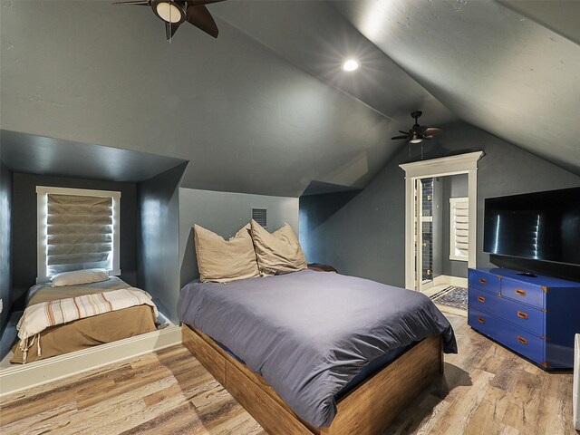 1018 Chaparrel Ln, Graford, TX 76449 - bedroom with vaulted ceiling, light wood-style flooring, a ceiling fan, and baseboards