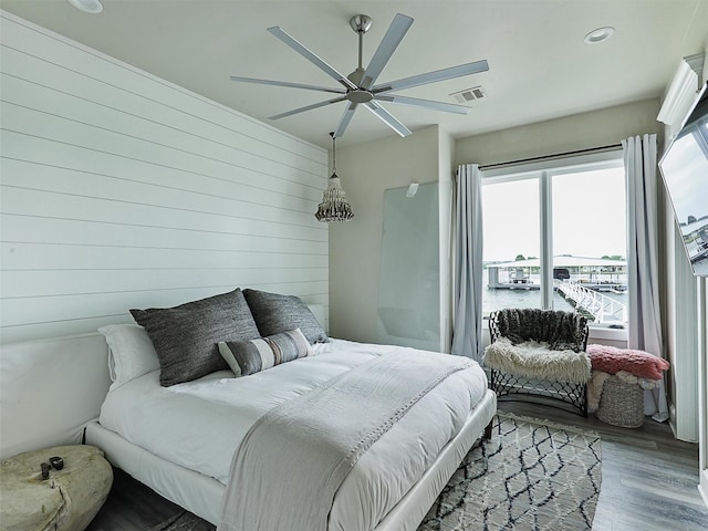 1018 Chaparrel Ln, Graford, TX 76449 - bedroom featuring wood finished floors, a ceiling fan, recessed lighting, and wooden walls