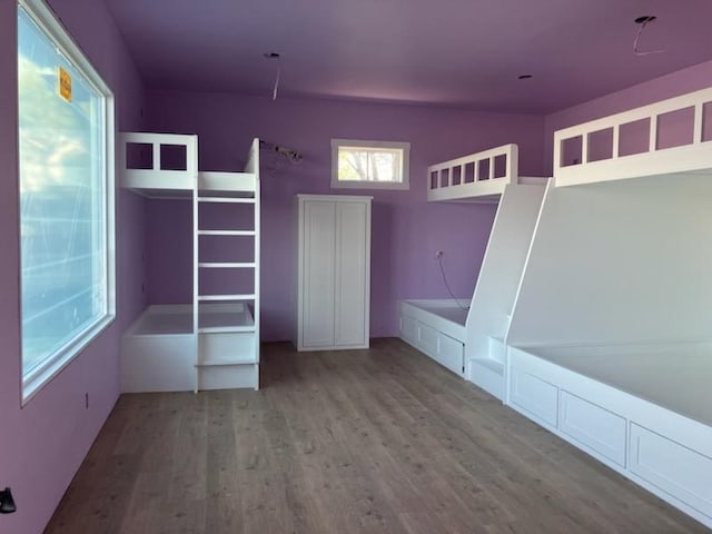 1018 Chaparrel Ln, Graford, TX 76449 - unfurnished bedroom with wood finished floors