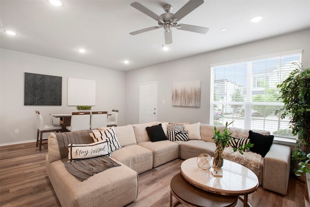 living room with recessed lighting and light wood finished floors