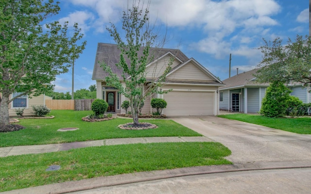 21107 Pine Monte Ridge Ln, Katy, TX 77449 - view of front of house with fence, an attached garage, concrete driveway, and a front lawn
