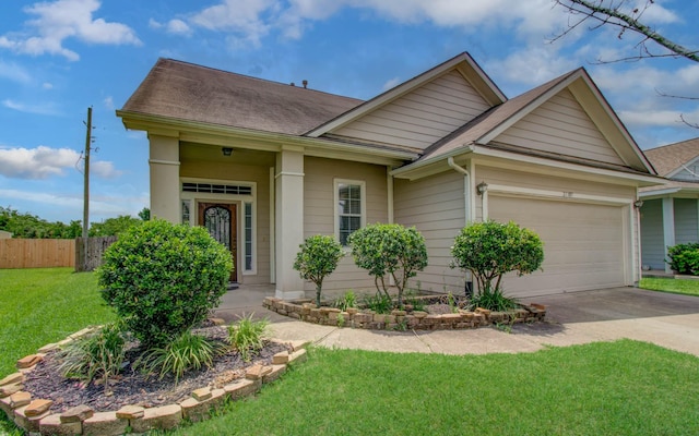 21107 Pine Monte Ridge Ln, Katy, TX 77449 - view of front of home with fence, roof with shingles, an attached garage, a front yard, and driveway