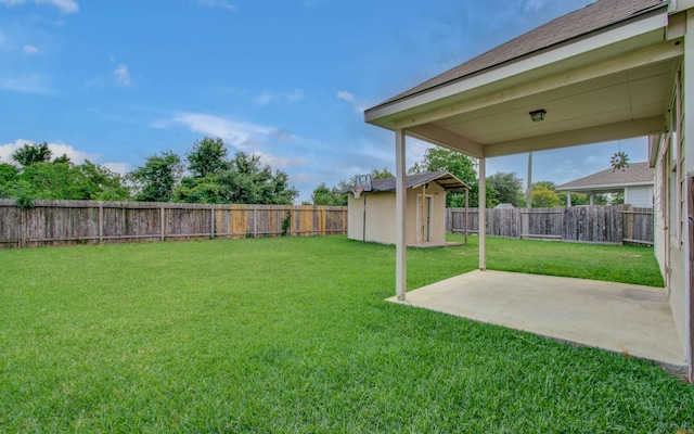 21107 Pine Monte Ridge Ln, Katy, TX 77449 - view of yard with a storage shed, a patio, an outdoor structure, and a fenced backyard