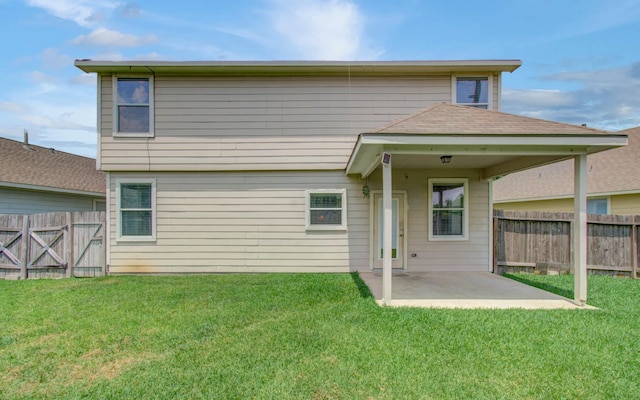 21107 Pine Monte Ridge Ln, Katy, TX 77449 - back of house featuring a lawn, a fenced backyard, and a patio area