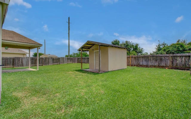 21107 Pine Monte Ridge Ln, Katy, TX 77449 - view of yard with an outdoor structure, a fenced backyard, and a storage unit