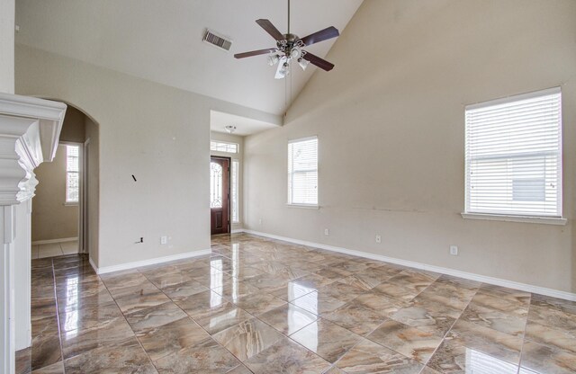 21107 Pine Monte Ridge Ln, Katy, TX 77449 - empty room with ceiling fan, visible vents, a wealth of natural light, and marble finish floor