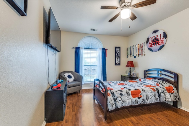 9813 Jericho Ln, Fort Worth, TX 76108 - bedroom with wood finished floors, baseboards, and a ceiling fan