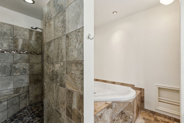 bathroom featuring a tile shower, recessed lighting, and a bath