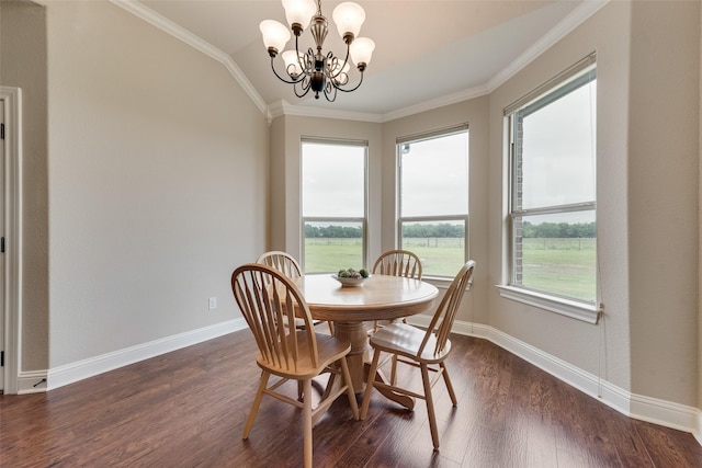 dining room featuring an inviting chandelier, ornamental molding, vaulted ceiling, and dark wood-style floors