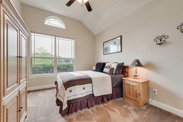 bedroom featuring baseboards, light carpet, and lofted ceiling