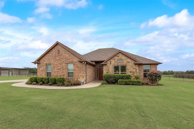 single story home with fence, a front yard, roof with shingles, and brick siding
