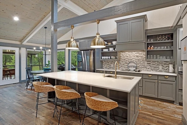 2449 Tanglewood Blvd, Pottsboro, TX 75076 - kitchen featuring stainless steel fridge, gray cabinetry, open shelves, a sink, and wooden ceiling