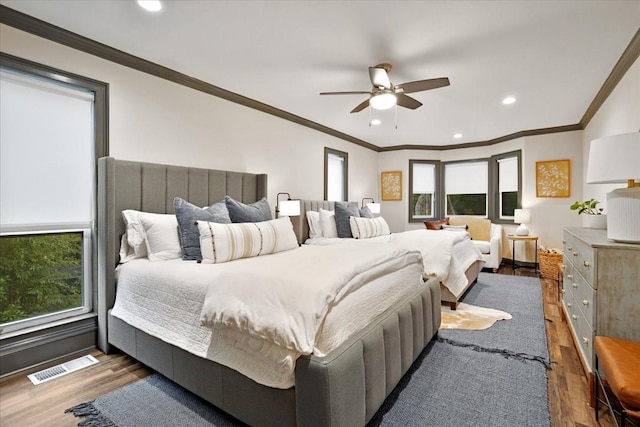 2449 Tanglewood Blvd, Pottsboro, TX 75076 - bedroom featuring wood finished floors, multiple windows, recessed lighting, ornamental molding, and ceiling fan