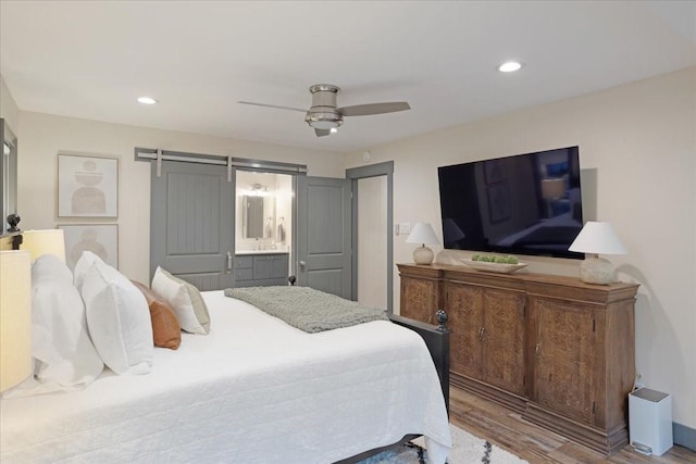 2449 Tanglewood Blvd, Pottsboro, TX 75076 - bedroom with wood finished floors, a ceiling fan, recessed lighting, and ensuite bathroom