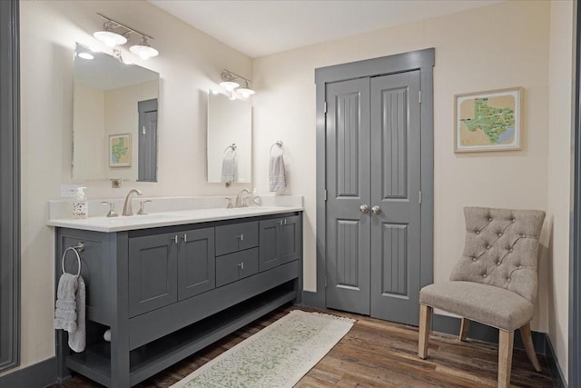 2449 Tanglewood Blvd, Pottsboro, TX 75076 - bathroom featuring wood finished floors and double vanity