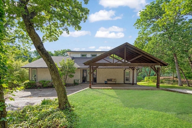 2449 Tanglewood Blvd, Pottsboro, TX 75076 - rear view of property with a yard, a gazebo, and roof with shingles
