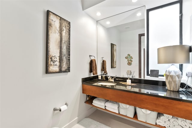 bathroom featuring recessed lighting, baseboards, tile patterned flooring, and vanity