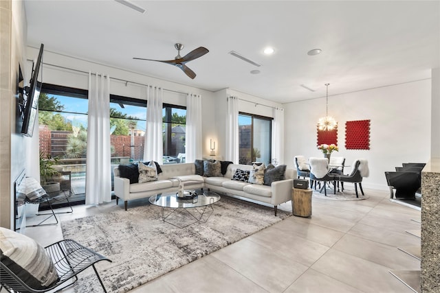 living room featuring visible vents, recessed lighting, and ceiling fan with notable chandelier
