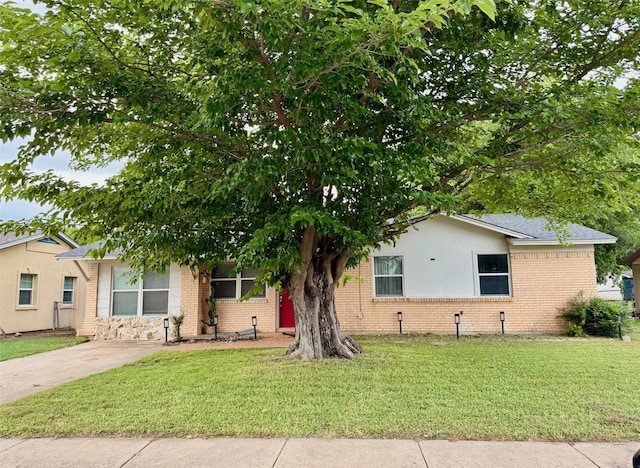 1617 Tyson St, Blue Mound, TX 76131 - view of front of property with roof with shingles, a front yard, driveway, and brick siding