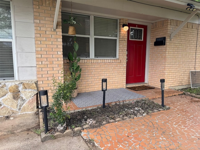1617 Tyson St, Blue Mound, TX 76131 - view of exterior entry featuring brick siding and a porch