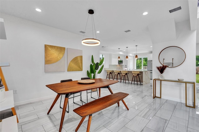 1619 Homeland St, Dallas, TX 75212 - dining space featuring baseboards, recessed lighting, and visible vents