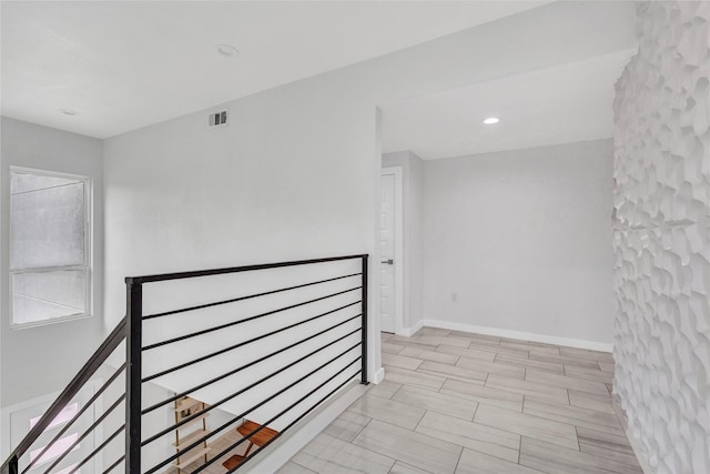 1619 Homeland St, Dallas, TX 75212 - hallway with an upstairs landing and visible vents