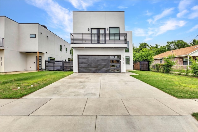 1619 Homeland St, Dallas, TX 75212 - modern home with an attached garage, fence, a balcony, and a front lawn