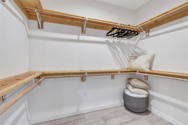 1619 Homeland St, Dallas, TX 75212 - walk in closet featuring light tile patterned flooring