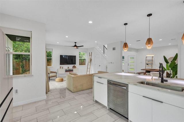 1619 Homeland St, Dallas, TX 75212 - kitchen featuring a ceiling fan, light stone countertops, white cabinetry, a sink, and dishwasher