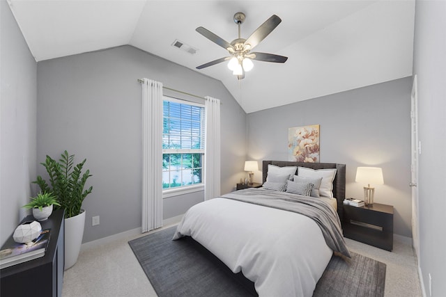 bedroom featuring carpet flooring, a ceiling fan, visible vents, and lofted ceiling
