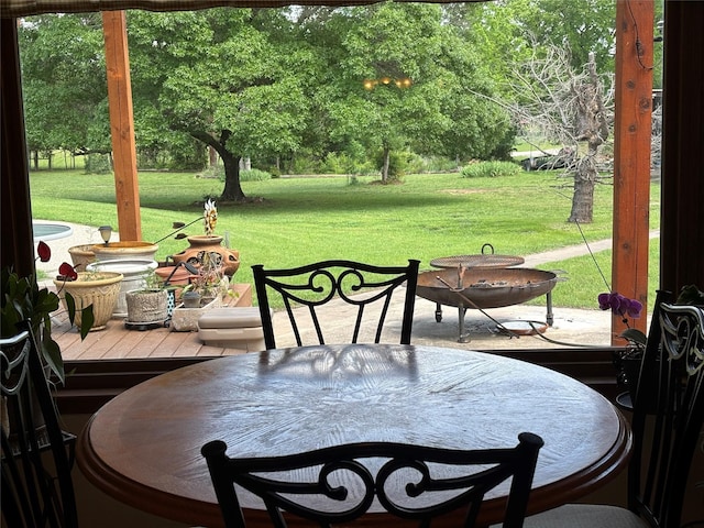 exterior space featuring outdoor dining area and a deck
