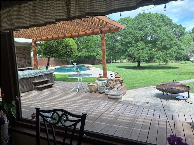 view of patio featuring a pergola, fence, a wooden deck, and an outdoor fire pit