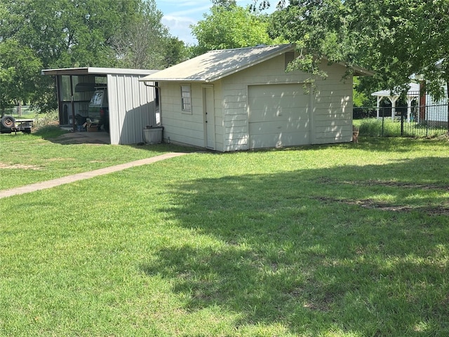 view of outbuilding with fence and an outbuilding